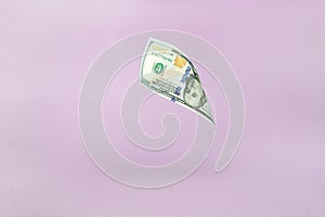 One hundred American dollars. 100. Flying of US dollar banknote on pink pastel background. Investment and saving concept