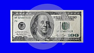 One hundred american dollars bill 3d spinning animation blue screen seamless looping