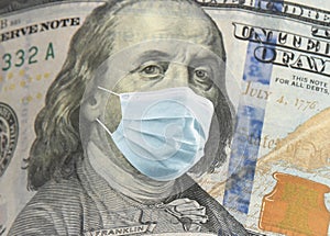 One hundred dollar banknote with face mask