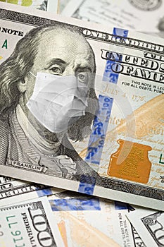 One Hundred Dollar Bill With Medical Face Mask on Benjamin Franklin