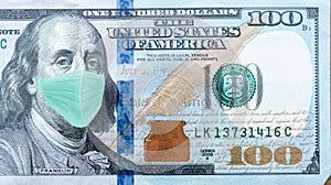 One Hundred Dollar Bill With Medical Face Mask on Benjamin Franklin