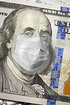 One Hundred Dollar Bill With Medical Face Mask on Face of Benjamin Franklin