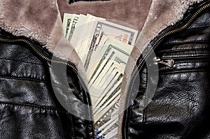 One hundred dollar bills in the pocket