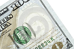One hundred dollars bill fragment. Closeup macro fragment. Fragment of bills close-up. New sample money