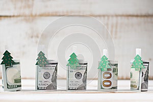 One hundred dollars rolls with clothespins decorated Christmas t