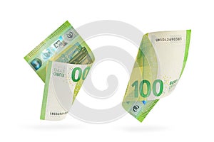 One hundred euro banknote set isolated on white background. European money folded in half, close-up of money casts a