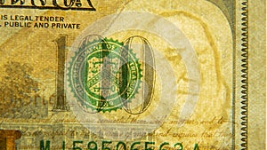 One hundred US dollars close-up with watermark.