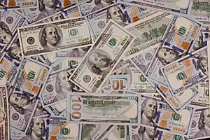 One hundred US dollars. Many banknotes. Benjamin Franklin, Independence Hall. photo
