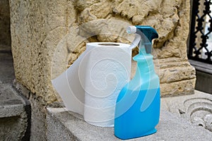 One kitchen napkins paper role and one  botle with desinfectant soap are displayed in front of a store in Bucharest, Romania photo