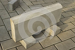 One large curb stone is made of concrete