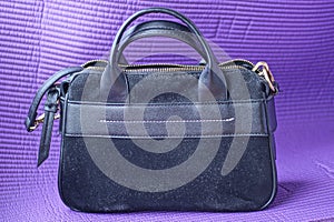 One large dirty black leather suede bag