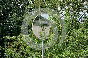 One large round observation mirror on a pole outside