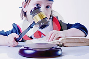 One law for all concept. Portrait of child girl judge lawyer. Humorous photo