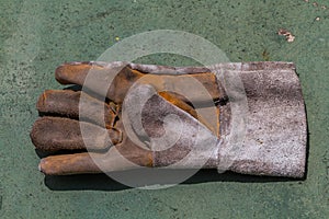 One left hand working glove.
