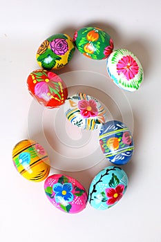 One of the letters of the word `Easter`. Letters are made of Easter eggs
