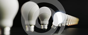 One light bulb glowing from others bulbs for outstanding ,different creative thinking idea and innovation concept by 3d render