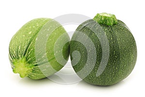 One light green and a green round zucchini