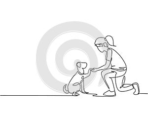 One line drawing of young happy girl handshaking her cute dog. Friendship about human and pet animal concept. Trendy continuous