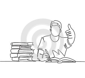 One line drawing of young happy male college student studying and reading stack of books in library while gives thumbs up gesture