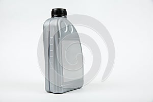 one liter bottle of car oil on white background