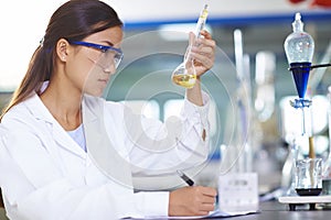 Asian Laboratory scientist working at lab with test tubes