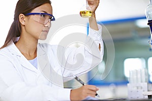 Asian Laboratory scientist working at lab with test tubes