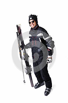 One male skier posing with full equipment on a white background