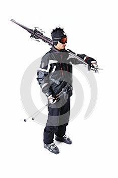 One male skier showing how to carry full equipment