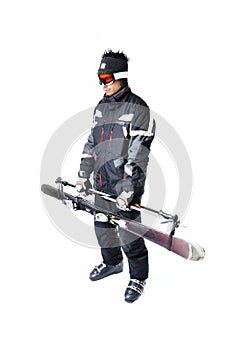 One male skier showing how to carry full equipment