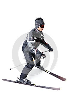 One male skier skiing with full equipment on a white background