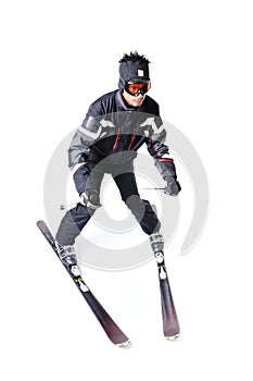 One male skier skiing with full equipment on a white background