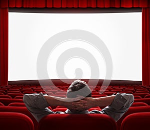 One man alone in empty cinema hall photo