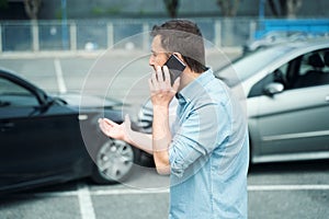 One man calling insurance roadside assistance reporting car accident problem