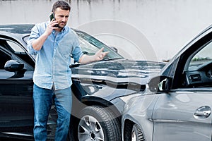 One man calling insurance roadside assistance reporting car accident problem