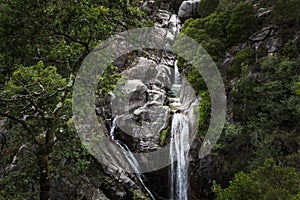 One man canyoning at the Arado Waterfall cascata do arado in the Peneda Geres National Park