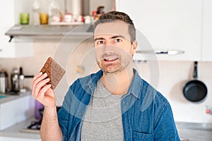 One man on diet tempted by chocolate sweet