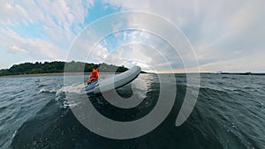 One man in inflatable boat sailing on river.