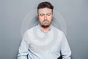 One man portrait  on gray background