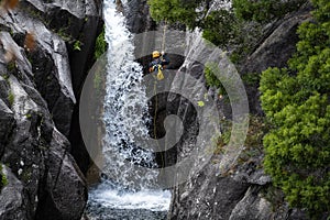 One man rappelling the Arado Waterfall cascata do arado in the Peneda Geres National Park photo