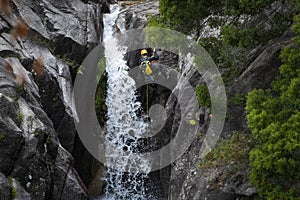 One man rappelling the Arado Waterfall cascata do arado in the Peneda Geres National Park
