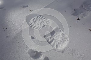 One man`s footstep on the fresh friable snow