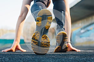 One man on the start line awaits the start of the sprint. stadium, rubber track. athletics competitions. Track and field runner in photo