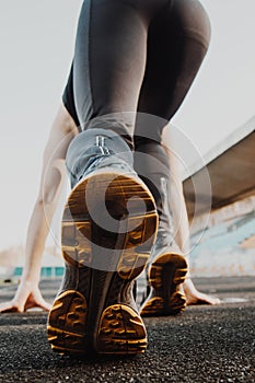 One man on the start line awaits the start of the sprint. stadium, rubber track. athletics competitions. Track and field runner in