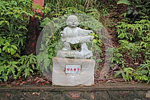 A monk sculpture on Guanyin Mountain, Guangdong Province, China