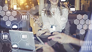 One-on-one meeting.Women have smartphone and digital tablet in their hands. Virtual icons with clouds,people,gadgets.