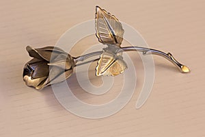 One Metal rose on a background for holiday greetings