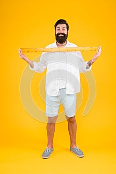One meter. Man bearded hipster holding ruler. Measure length. Size tall and length. Big size. Measure. Geometry theorem