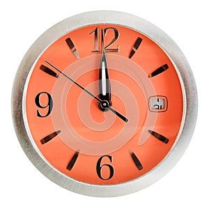 One minute to twelve o'clock on orange dial