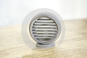One model printed on 3D printer. Gray object printed on 3D printer made plastic