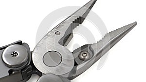 One modern gray iron open folding multifunctional knife on a white background. Multi-tool with advanced tools. Pliers